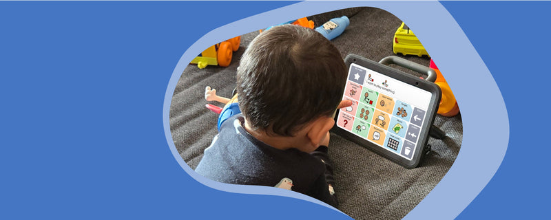 Young boy with Talk Pad Wego 8 and Vocochat vocabulary set.