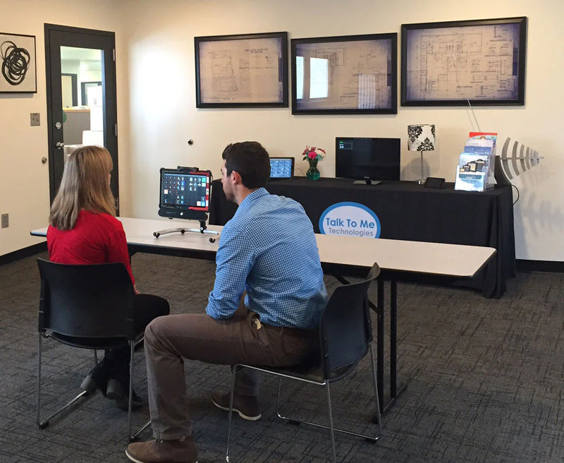 Amanda Gilbert sits with AAC consultant Wyatt Franken