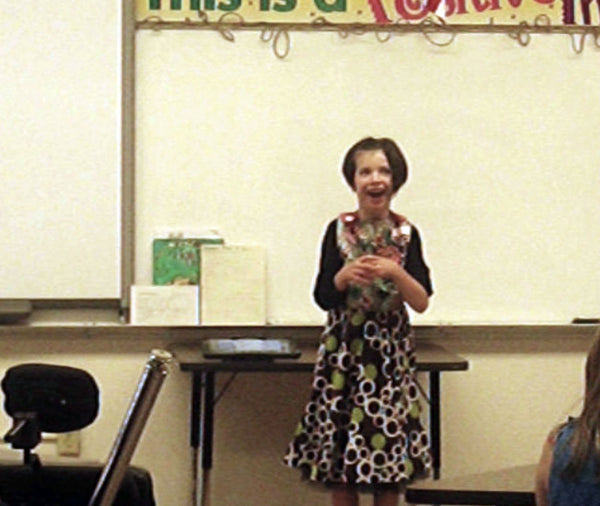 fifth grader with cerebral palsy participating in their speech meet