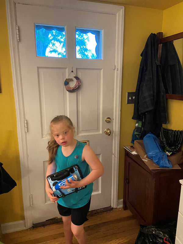 Bea at the front door with her speech device