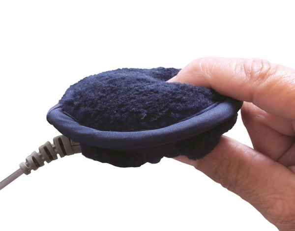 Close up of hand holding Pillow Speaker 